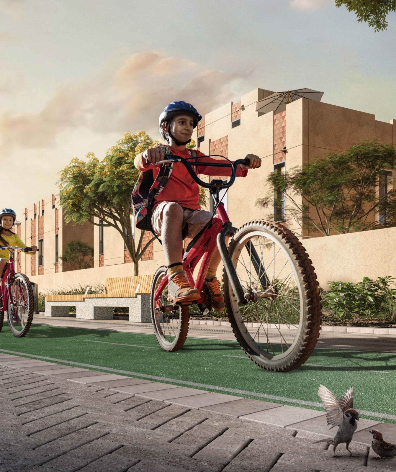 Boy cycling through a ROSHN Group community